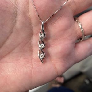 Beautiful half carat diamond necklace set in 14k gold.